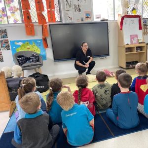 trainer teaching at childcare junior safety and wellbeing. empowering young people with the skills to support their own mental health and build resilience as well as learning how to identify the signs and symptoms of someone who may be struggling with their own mental health.