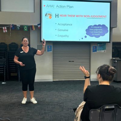 trainer teaching teens mental health awareness