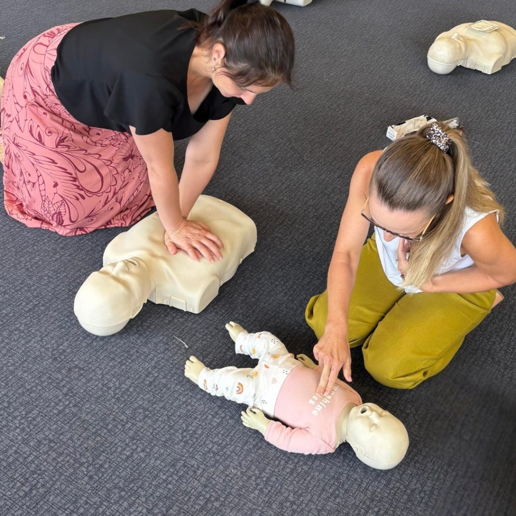 two ladies doing cpr training on manikins at a FAST First Aid Training public courses