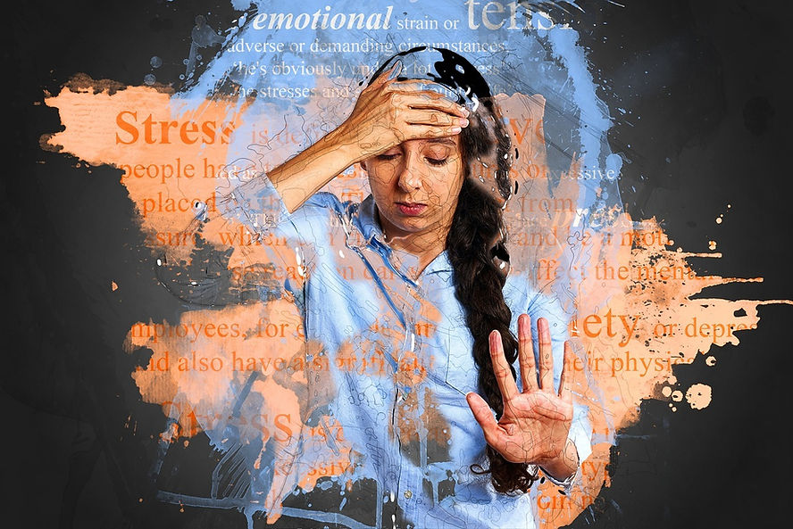 Woman suffering from workplace stress and the importance of delivering mental health awareness and mental health first aid training at your workplace. 