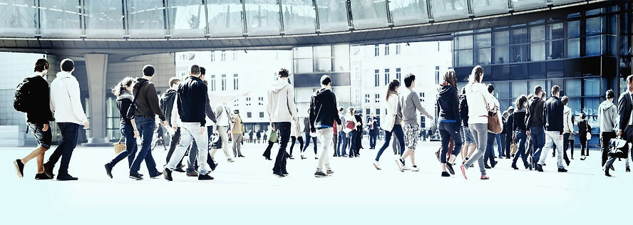 People rushing about, the impact of chronic stress and the importance of learning mental health first aid