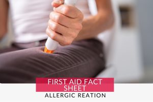 Person using Epi Pen on thigh for a severe allergic reation
