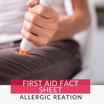 Person using Epi Pen on thigh for a severe allergic reation