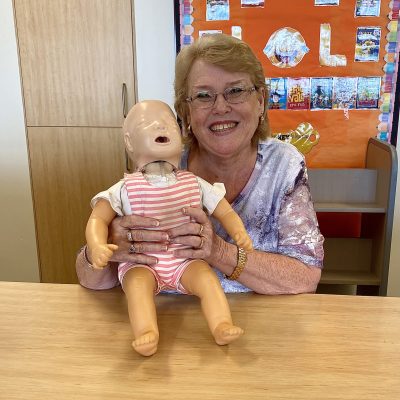 School Teacher with the baby Annie CPR Resuscitation manikin at a Staff First Aid and CPR Training at Ipswich Grammar School Ipswich