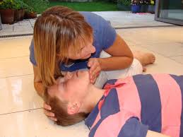 assessing for breathing on an unconscious casualty. Learn CPR and save a life.