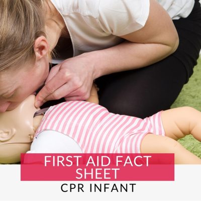 Woman performing CPR on an infant mannequin learning how to perform cpr on an infant