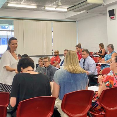 Facilitating conflic resolution trainer teaching conflict resolution and clear and connected communication at a workplace in Brisbane