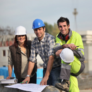 Construction workers on-site discussing construction industry skills and the importance of workplace training and whs compliance.