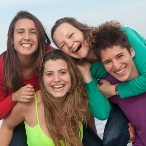 happy teenagers advocating the need for youth mental health training