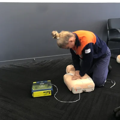 electrician demonstrating defib in a first aid and cpr training course