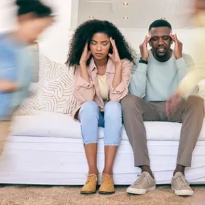 two stressed parents trying to manage teen mental health. Supporting parents and managing their stress and teaching them to regulate their nervous system will help their children. 