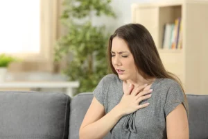 Woman experiencing pain in chest