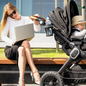 working mum with a pram and a computer. Work life balance is a struggle. Teaching our kids to be resilient and independent is important to their development. Youth mental health