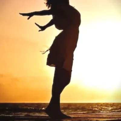 lady in the sunset taking care of her mental health.