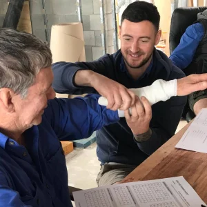 applying bandage in a workplace first aid training course in Brisbane. First Aid and CPR course Brisbane.