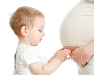 boy-touching-mums-pregnant-belly