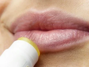 putting-chapstick-on-dry-lips sign of dehydration