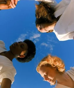 looking upwards to a group of teens