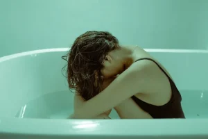 Upset lady in the bathtub