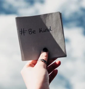 be-kind-message-in-hand wellbeing tips