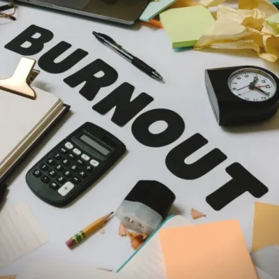 an image of a clock identifying the risk of employee burnout is and how important workplace training is