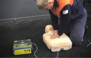 person doing cpr training on a manikin at a CPR course in Ipswich