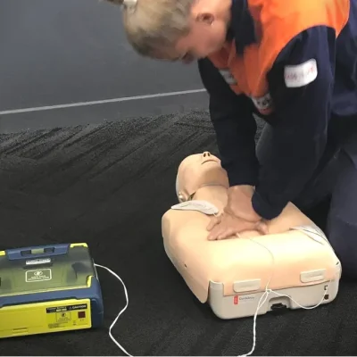 person doing cpr training on a manikin at a CPR course in Ipswich
