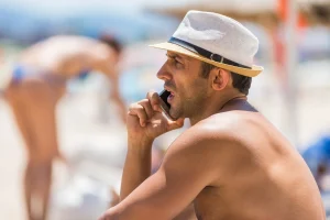 man-on-beach taking time to enjoy a work life balance and reduce stress