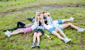 youth-laying-on-ground-in-circle