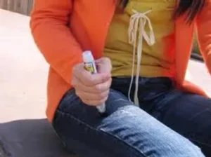 Person using an Epi-pen