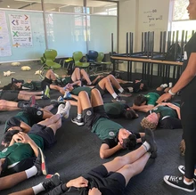 teenager lying on ground doing a visualisation strategy. youth safety and wellbeing Mental health strategies for teens