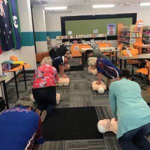 People performing CPR on the mannequins First Aid Officer and first aid compliance